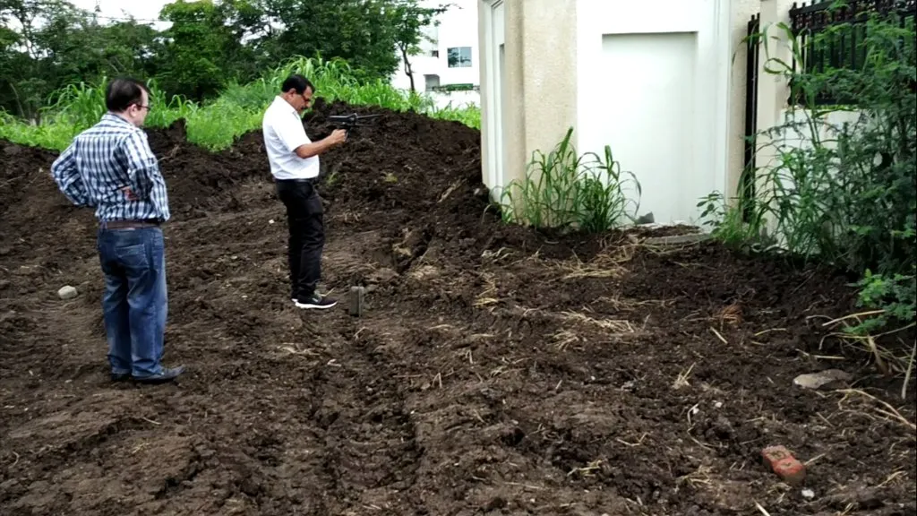 Hydrogeology field team conducting soil permeability and subsurface water pressure testing at an infrastructure project site in India.
