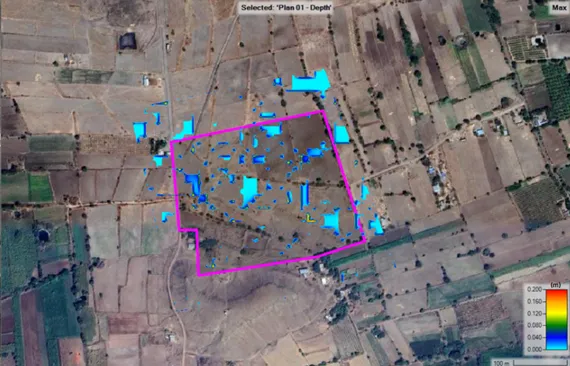Hydrologist reviewing drone survey data for solar plant hydrology